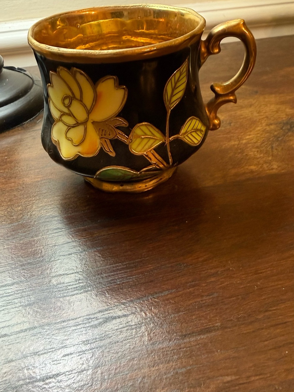 Black and Gold Floral Porcelain Mug with Yellow Flower Accent